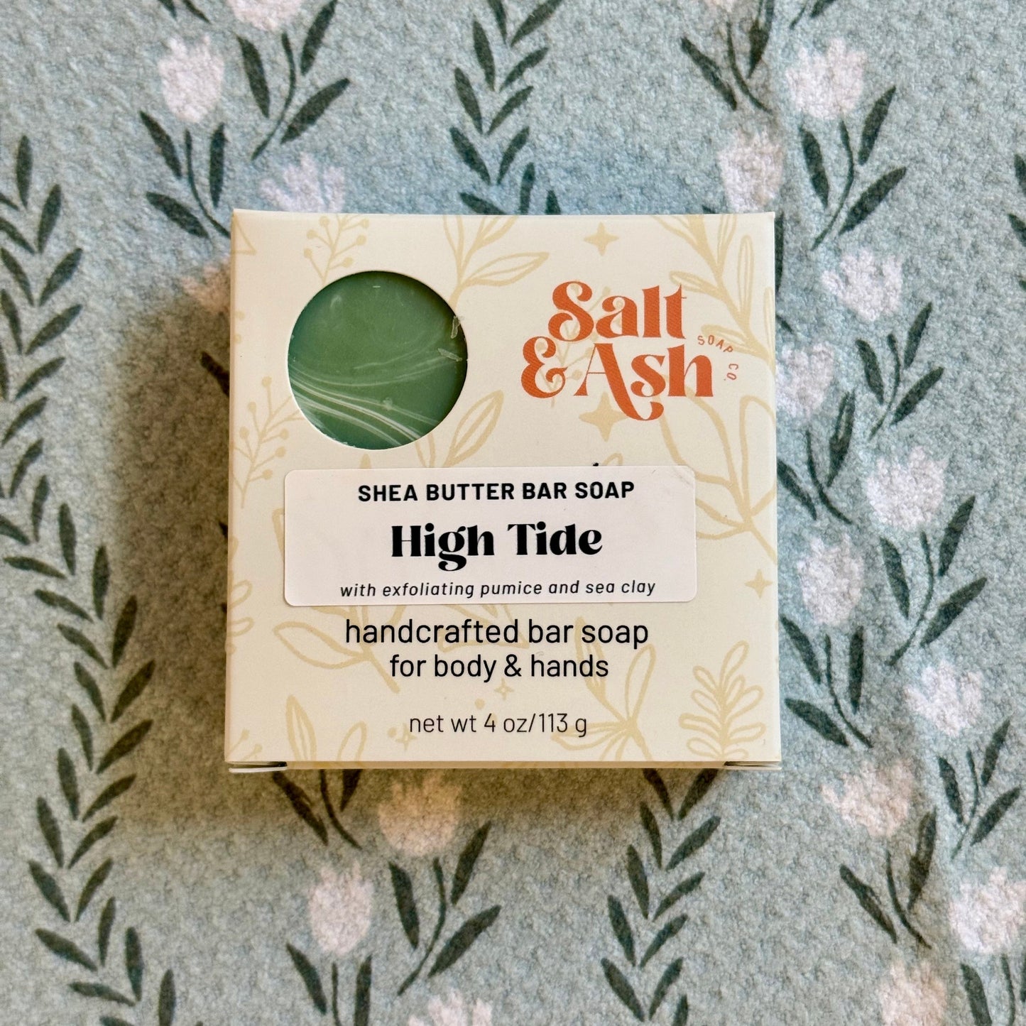 Box of Salt & Ash Shea Butter Bar Soap with a floral patterned background