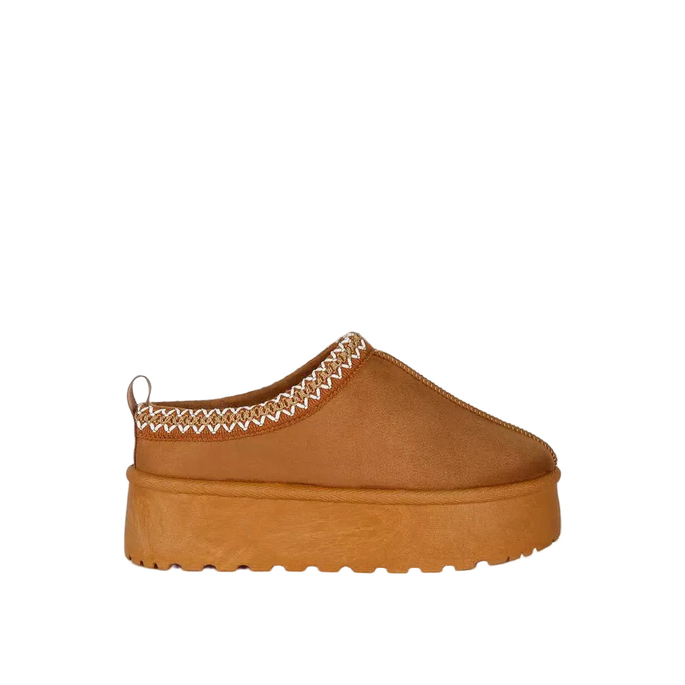 Brown platform slip-on shoe with decorative trim on a white background